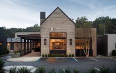 the exterior of a restaurant called califier in an empty parking lot at dusk