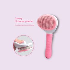 a pink hair brush with a white bristles on it's side and a pink comb in the foreground