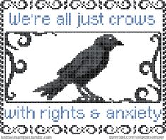 a black bird sitting on top of a white frame with words that say we're all just crows