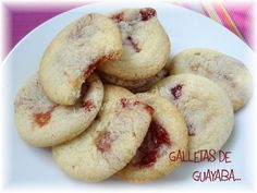 a white plate topped with cookies covered in jelly