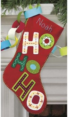 a stocking hanging from a christmas tree with the words happy holidays written on it