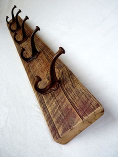 an old wooden sleigh with three handles on the top and one handle is bent down