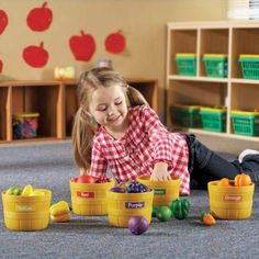 This set of realistic fruits & veggies is a great tool for matching, sorting, and color recognition activities.· Characteristics: This set includes 25 plastic fruits and vegetables, 5 baskets and 5 color label stickers - red, orange, green and yellow.· Size and Color: Each light brown basket measures 4 inches tall and 5 ½ inches across. The fruits and vegetables are colored realistically but the main hues are purple, yellow, green, red and orange.· The Farmers Market Color Sorting Set from Play Kitchen Food, Vegetable Market, Color Sorting Activities, Farmers Market Recipes, Pretend Play Kitchen, Learning Toys For Toddlers, The Toys, Sorting Activities, Color Sorting