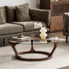 a living room with two couches and a coffee table in the middle of it