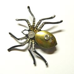 "Black-silver or silver colored steampunk necklace Spider, handmade decorated, including mechanical part of clockwork and miniature container (amulet, talisman, ju-ju, pill box, keepsake locket, stash box). The chain can easily be removed and the necklace turns into a brooch. Diameter of the Spider about: 2\" - 2 1/4\" / 5.5-6 cm Dimensions of the golden locket container: 7/8\" x 5/8\" / 2.2 cm x 1.5 cm; inside 5/8\" x 3/8\" / 1.5 cm x 1 cm Black-silver or silver colored chain. The black spider Silver Steampunk Collectible Jewelry, Gothic Brooch Jewelry Gift, Steampunk Locket Jewelry Collectible, Victorian Metal Brooches As Gift, Unique Metal Brooch Gift, Handmade Metal Brooches As Gifts, Handmade Metal Brooches For Gifts, Steampunk Spider, Golden Locket