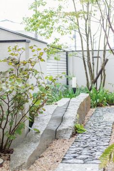 a stone path in front of a house