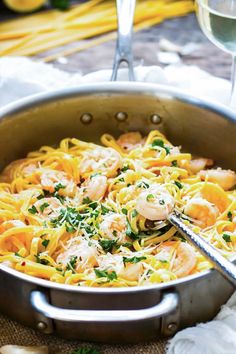 pasta with shrimp and parsley in a pan