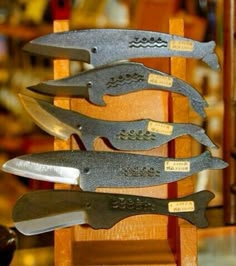 five knives are stacked on top of each other