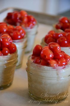 small jars filled with food sitting on top of a table