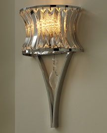 a wall light with a glass shade on it