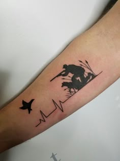 a person with a tattoo on their arm that has birds flying over them and an airplane in the sky