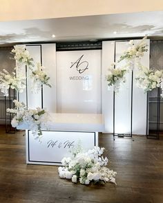 an aisle decorated with white flowers and greenery for a wedding ceremony at the four seasons hotel