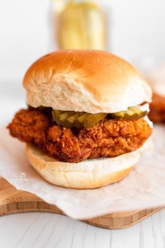 a chicken sandwich with pickles on it and the words copycat chick - fil - a