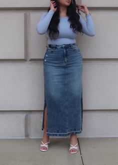 PRODUCT DETAILS: Medium wash denim maxi skirt Comfort Stretch Double side slit 5 pockets Functional buttons and zipper Raw hem True to size Length: Slit length: Model is wearing a size Large Model Info: Height: 5'6", Bust: 41", Waist: 34, Hips: 41" 98% Cotton, 2% Spandex Skirts With Slits On Both Sides, Istanbul Outfits, Long Denim Skirt Outfit, Jeans Long Skirt, Classy Short Dresses, Jean Skirt Outfits, Elegant Wear, Trendy Outfit Ideas, Cute Modest Outfits