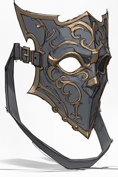 a mask that is sitting on top of a white surface and has gold details around it