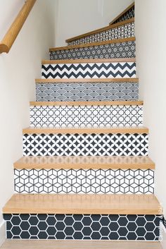 an image of some stairs painted with black and white tiles