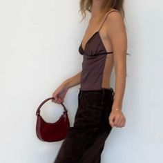 Brown Fleur Top Flirty Camisole With Built-in Bra For Date Night, Elegant Backless Tank Top With Built-in Bra, Chic Tank Top With Built-in Bra, Sleek Camisole With Built-in Bra For Night Out, Chic Strappy Back Tank Top With Tie Detail, Chic Strappy Back Tank Top With Tie, Chic Strappy Back Tie Tank Top, Chic Camisole With Built-in Bra For Brunch, Flirty Camisole With Built-in Bra For Night Out