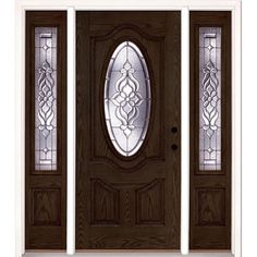 a wooden door with two sidelights and stained glass panels on the top half of it