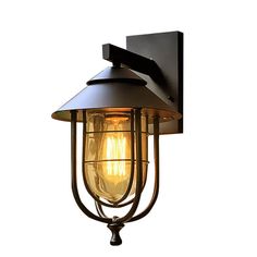 an outdoor wall light that is black and has a yellow light bulb on the side