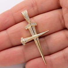 2" CZ Screw Nail Cross Pendant Real Solid 14K Yellow Gold * Metal : Real Solid 14K Gold (Properly Stamped, 14K) * Condition : Brand New * Finish : Polished * Average Weight : 3.98 grams * Length : 52mm = 2" * Width : 26mm = 1" * Clasp/Bail : 9.5mm by 6mm All of our items are brand new and are shipped with a gift box. Nail Cross, Average Weight, Cross Pendant, Jewelry Necklace Pendant, Gold Metal, Pendant Necklaces, 14k Gold, Jewelry Necklaces, Accessory Gift