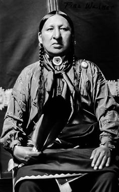 an old black and white photo of a native american woman