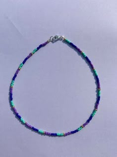 Cute, cool tone, seed bead choker! Blue Beaded Necklaces With Heart Beads For Festivals, Sead Beads Diy Jewelry, Casual Turquoise Beaded Necklaces With Tiny Beads, Trendy Blue Beaded Necklace With Tiny Beads, Summer Purple Beaded Necklaces With Colorful Beads, Seed Bead Color Combos, Trendy Blue Choker With Tiny Beads, Colorful Beaded Choker Necklaces For Summer, Trendy Colorful Beaded Choker Necklace