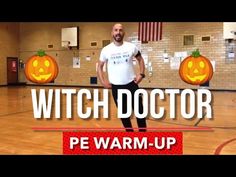 a man standing on top of a basketball court in front of two jack - o'lanterns