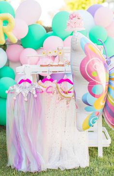 an assortment of balloons and decorations for a birthday party