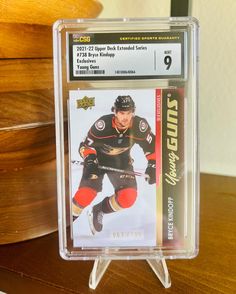 a hockey card in a plastic holder on a table