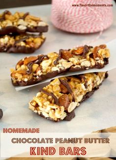 homemade chocolate peanut butter kind bars with nuts on top and text overlay that reads homemade chocolate peanut butter kind bars