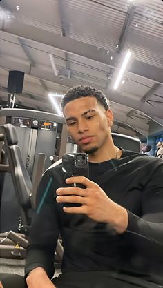 a man taking a selfie in the gym