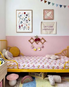 a child's bedroom decorated in pink, yellow and white