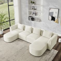 a living room with a large white sectional couch