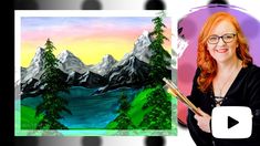 a woman is holding a paintbrush in front of an image of mountains and trees