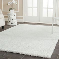 a white rug on the floor in a living room