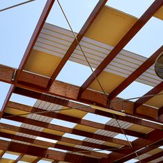 the ceiling is covered with wooden slats