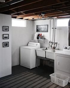 a white washer and dryer sitting in a laundry room next to each other