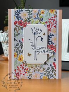 a happy birthday card with flowers on it