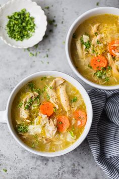 two white bowls filled with chicken and rice soup