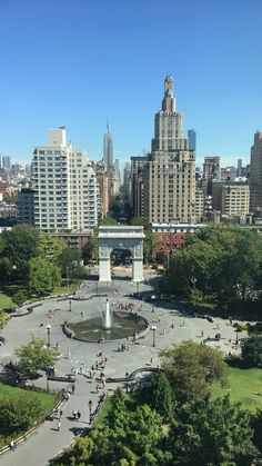 an aerial view of a city park and fountain