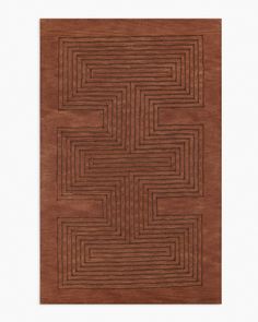 a brown rug with an intricate design on it