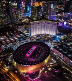 an aerial view of the las vegas strip at night with lights and buildings in the background