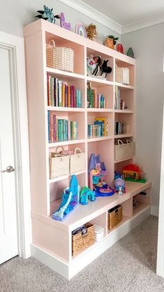 a pink book shelf filled with lots of books