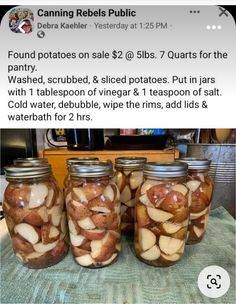 four jars filled with food sitting on top of a table