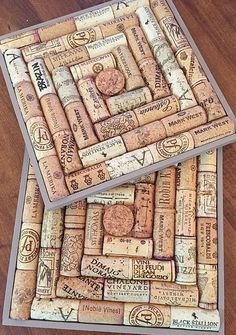 two coasters made out of wine corks sitting on top of a wooden table