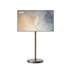 a lamp that is on top of a metal stand with a white and blue background