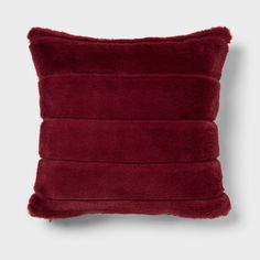 a red pillow that is made out of plush material