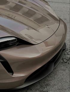 the front end of a silver sports car