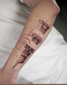 a person with a tattoo on their arm that has a clock and roman numerals