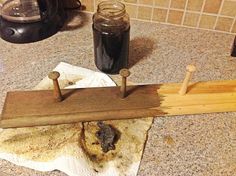 a dirty kitchen counter top with some food on it and two glasses next to it